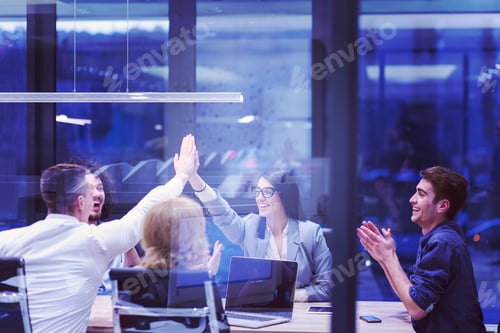 Preview: startup Group of young business people celebrating success