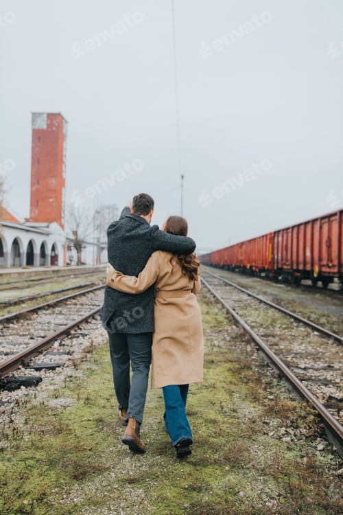Preview: Closeup of a couple walking near the railway