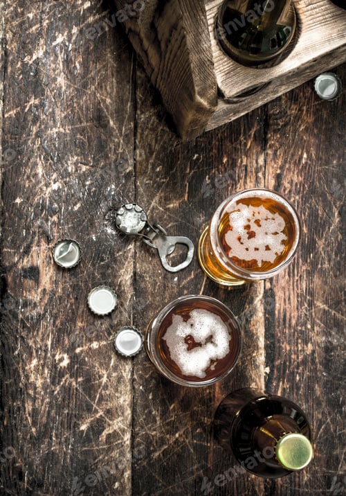 Preview: Fresh beer in a glass with stoppers and a bottle opener.