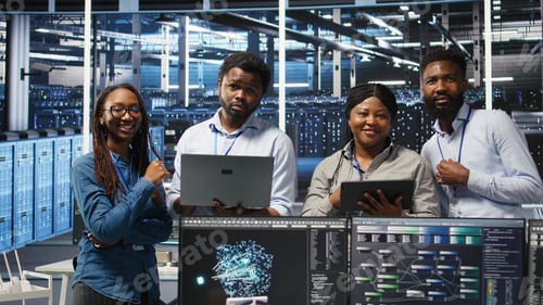 Preview: Portrait of smiling data center specialists collaborating in server facility
