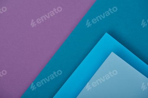 Preview: top view of purple and blue paper sheets with copy space