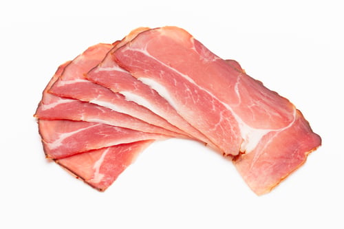 Preview: Hamon sliced on white background. Spanisch traditional meat.