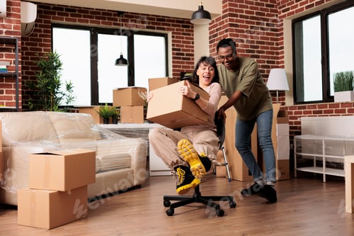 Preview: Cheerful homeowners enjoying moving in new rented household
