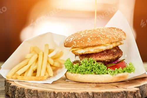 Preview: Junk food set on wooden plate.