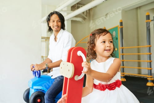Preview: Father and Daughter on Playground