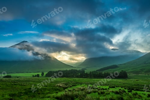Preview: Foggy sunset over the mountains of Glencoe in Scotland