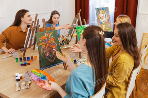 Preview: Group of women learning to draw at table in class