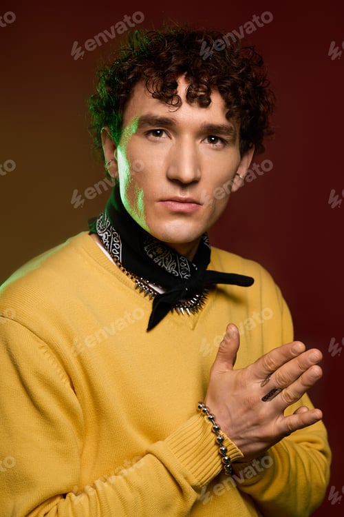 Preview: Stylish gentleman in vibrant attire showcasing confident expression and unique accessories