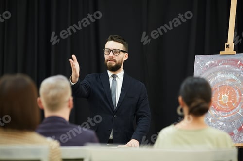 Preview: Young man holding the auction