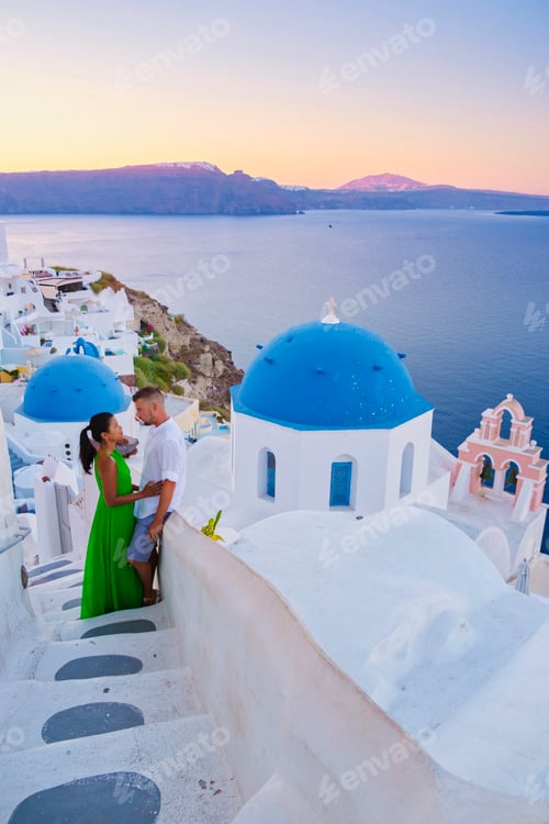 Preview: Couple hugging and kissing on a romantic vacation in Santorini Greece, men and women visit Santorini