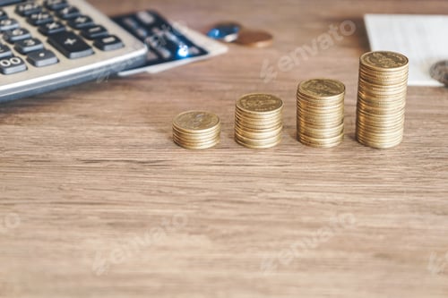 Preview: Stack of golden money coin on office table. Business and financial concept.