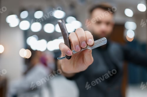 Preview: Barber shows shaving razor close-up