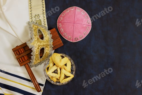 Preview: To commemorate Jewish holiday Purim, rattles, carnival masks, a hamantaschen cookies are used as