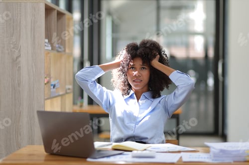 Preview: African woman in office stressed pressure of overwork.