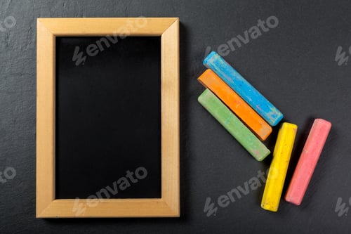 Colorful Chalk and Black Chalkboard Background