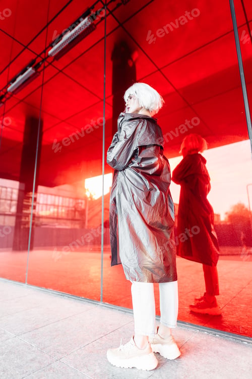 Preview: Fashion blonde in a futuristic image on a red background.