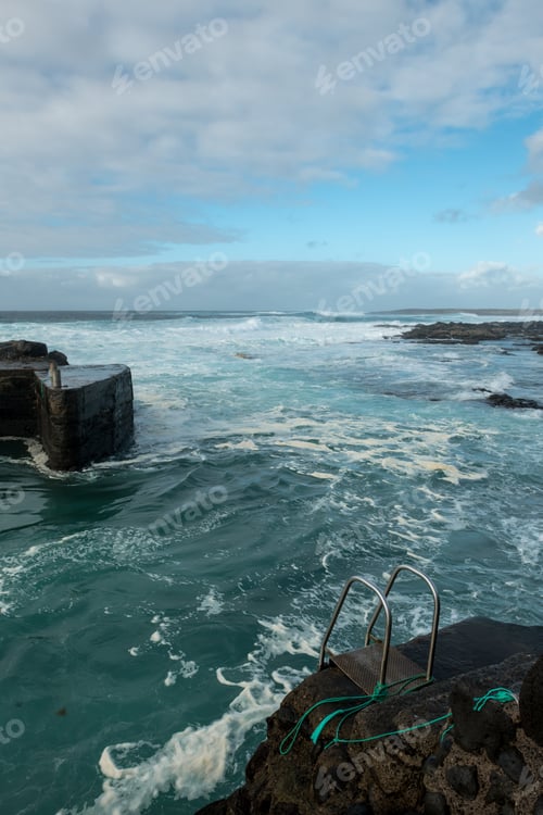 Preview: Sea waving near stone pier