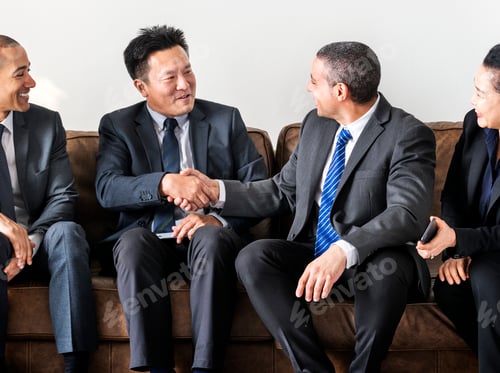 Preview: Business people sitting together on couch