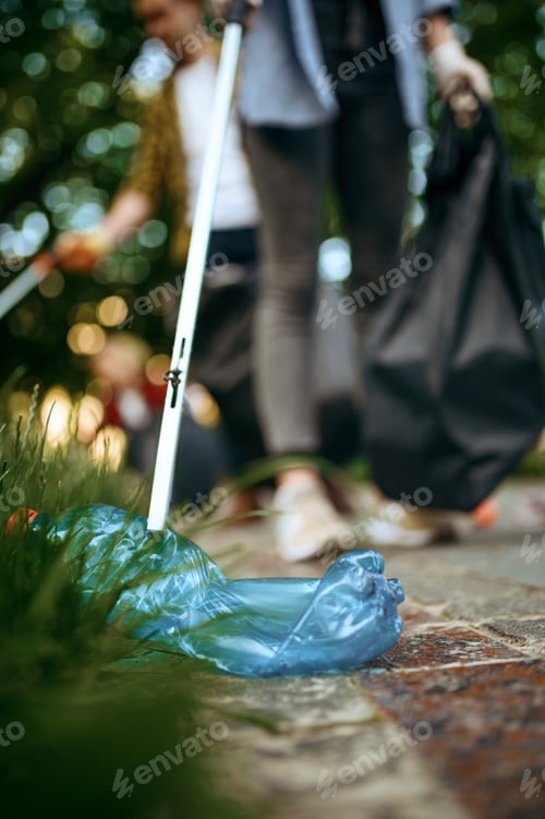 Preview: Young volunteers picking trash in plastic bags