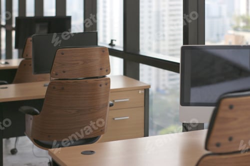 Preview: wooden table desk in office business room with big computer monitor and windows background