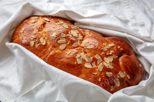 Preview: Easter sweet bread, homemade tsoureki braid on white table cloth