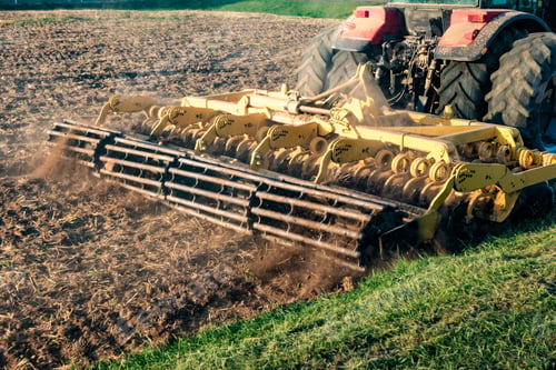 Preview: tractor cultivator plows the land, prepares for crops. dust on field