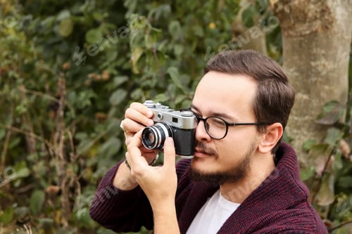 Preview: portrait of a man, a professional photographer, in a forest