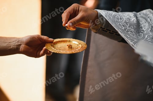 Preview: Priest during a wedding ceremony - nuptial mass.
