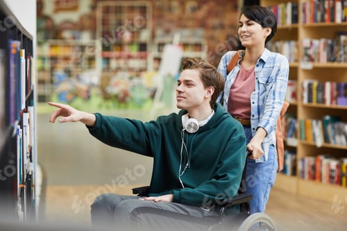 Preview: Boy in wheelchair choosing book