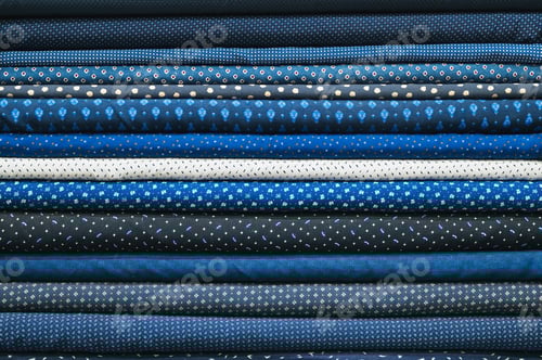 Preview: Stacked Blue Fabrics with Varied Patterns and Textures