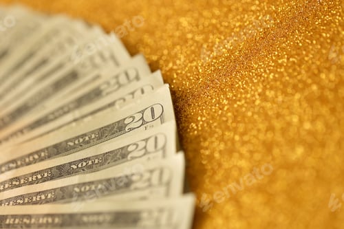 Preview: Big amount of old twenty dollar bills on golden background