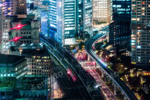 Preview: Several sky train passing through illuminated building in business district at Tokyo, Japan
