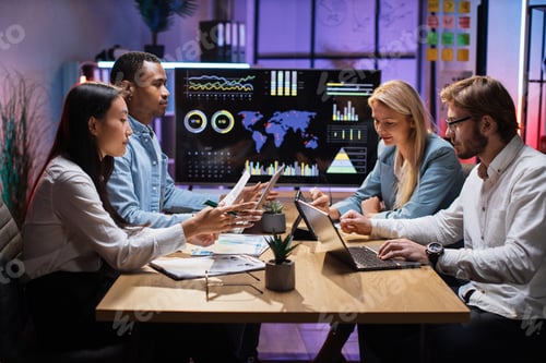 Preview: International team of financiers using gadgets at office