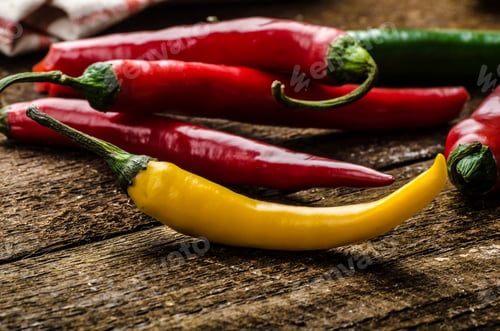 Preview: Chilli peppers, wood table, background