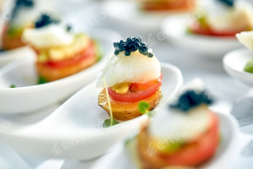 Preview: Delicious tartlets with black caviar. Concept of food, restaurant, catering, menu.