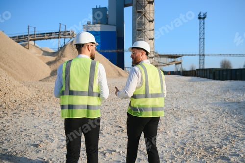 Preview: Two engineers at an industrial plant. Crushed stone production plant. Gravel
