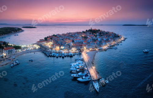 Preview: Aeriel view of old town with street lights on island at night. Summer in Primosten, Croatia