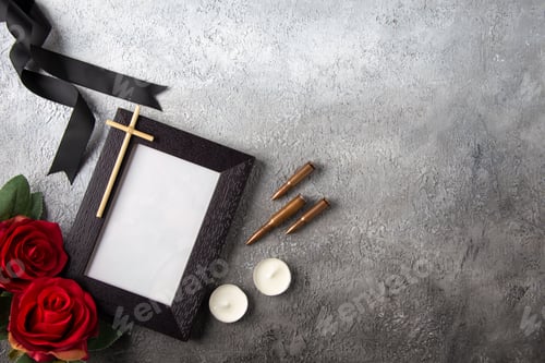Preview: top view of picture frame with red flowers on white background death tank war
