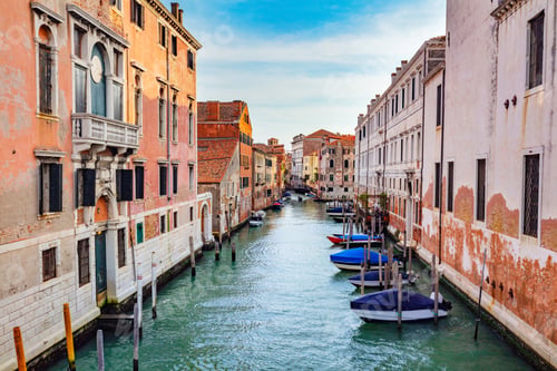 Preview: Venice, Italy a canal with bridge and boats.