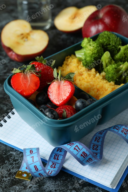Preview: Diet concept with lunch box on black smokey table