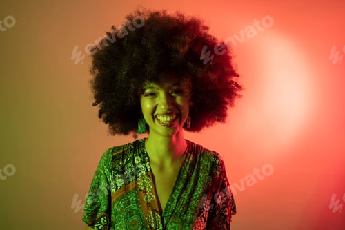 Preview: Portrait young beautiful multiethnic woman studio shot on colorful background