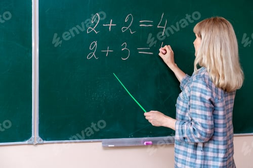 Preview: Back to school. The professor solves the problem at the blackboard