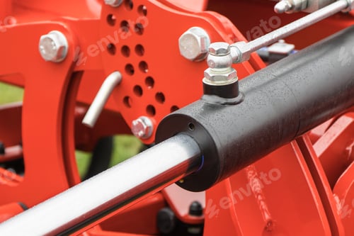 Preview: Black piston or actuator in red pneumatic or hydraulic machine. Technology