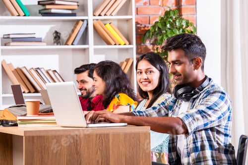 Preview: Indian asian four college or university students using laptop together