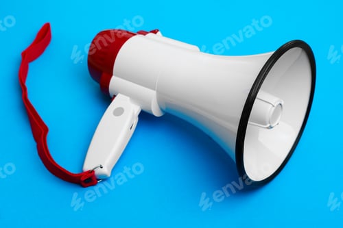 Preview: Electronic megaphone on blue background close up