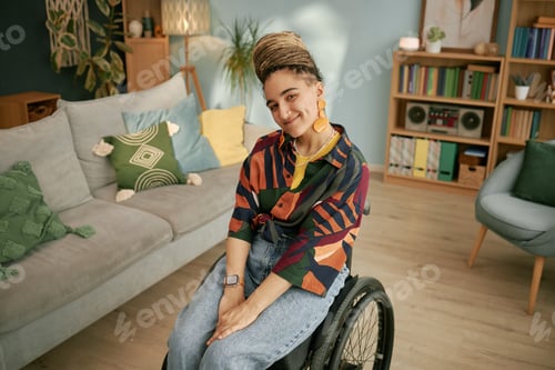 Preview: Portrait of Young Adult Caucasian Woman in Wheelchair Smiling during Birthday
