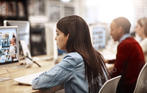 Preview: Woman Working at Computer in a Modern Office