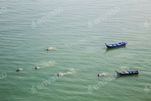 Preview: Fishermen harvesting shellfish and fish from the sea with net