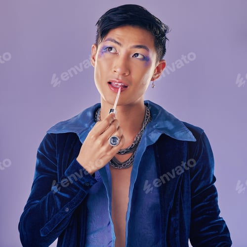 Preview: Beauty, makeup and lgbt Asian man in studio on purple background using cosmetics, beauty products a