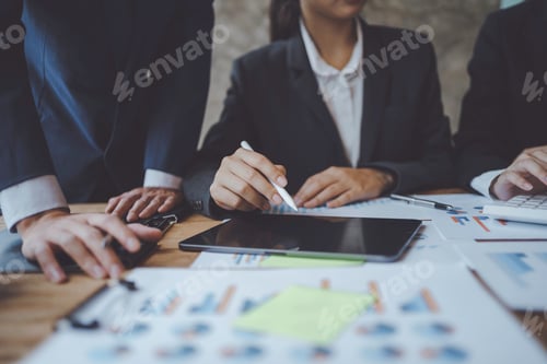 Preview: Close-up of hands of a group of business people working together in the office meeting and planning